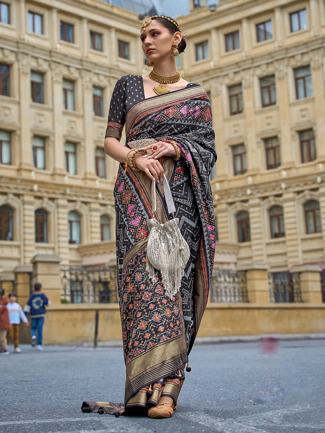 

Mitera Black Geometric Printed Zari Patola Saree