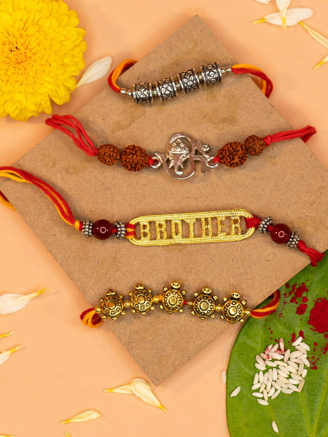 

Yellow Chimes Set Of 4 Rakhi With Roli Rice & Greeting Card, Gold