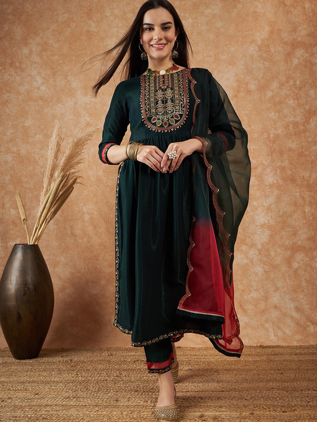 

Sangria Green Ethnic Motifs Yoke Design A-Line Thread Work Kurta With Trousers & Dupatta