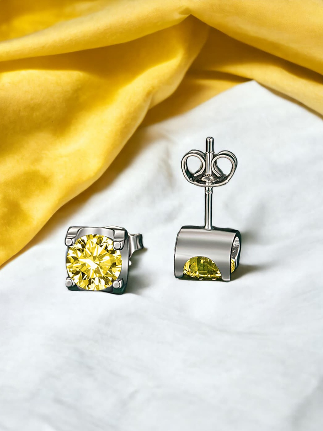 

Designs & You Silver-Plated Cubic Zirconia Studded Contemporary Studs Earrings