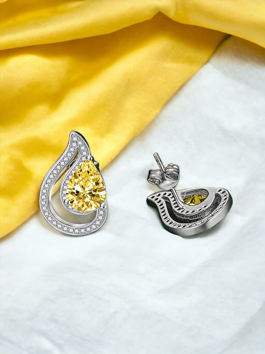 

Designs & You Silver-Plated Cubic Zirconia Stone Studded Teardrop Shaped Studs Earrings, Yellow