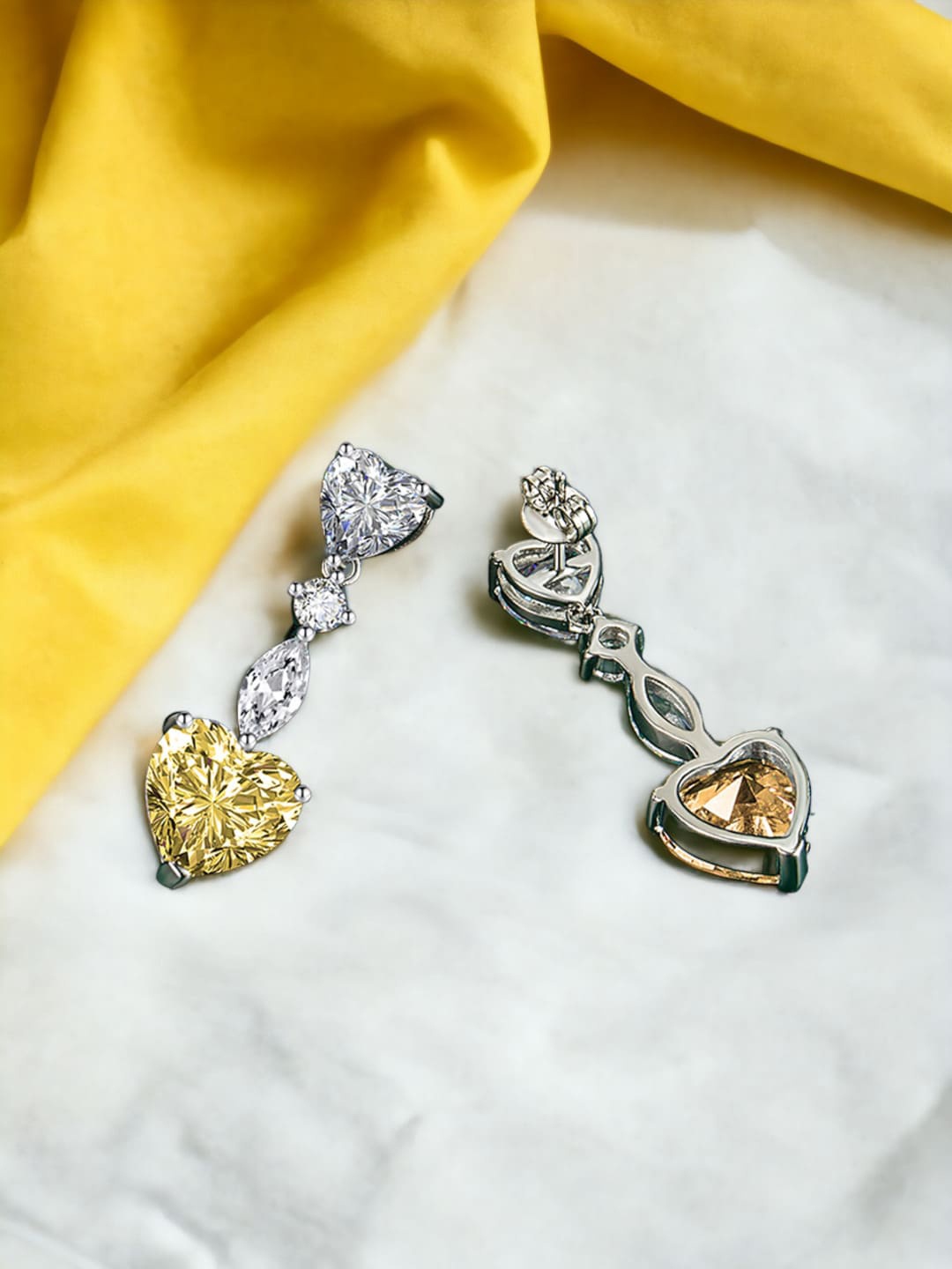 

Designs & You Silver-Plated Heart Shaped Cubic Zirconia Drop Earrings