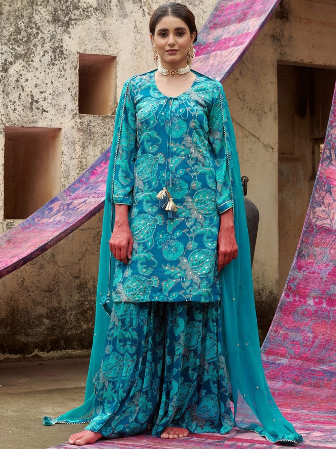 

KARAJ JAIPUR Floral Printed Tie-Up Neck Sequinned Straight Kurta With Sharara & Dupatta, Turquoise blue