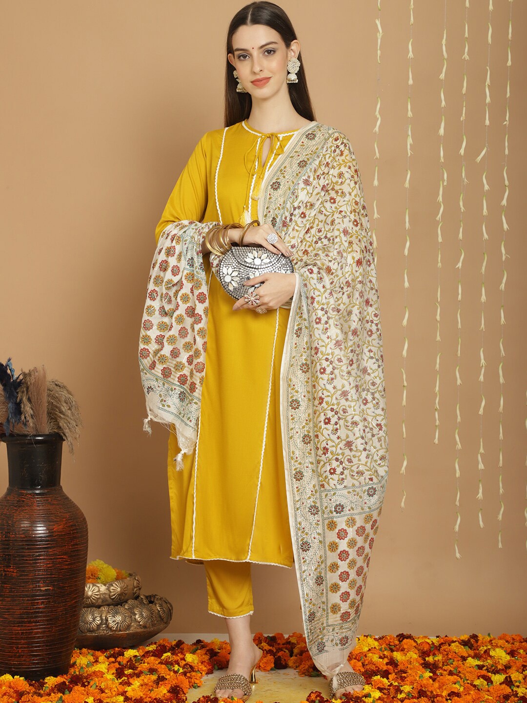 

Tulsattva Tie-Up Neck Kurta With Trousers & Dupatta, Mustard
