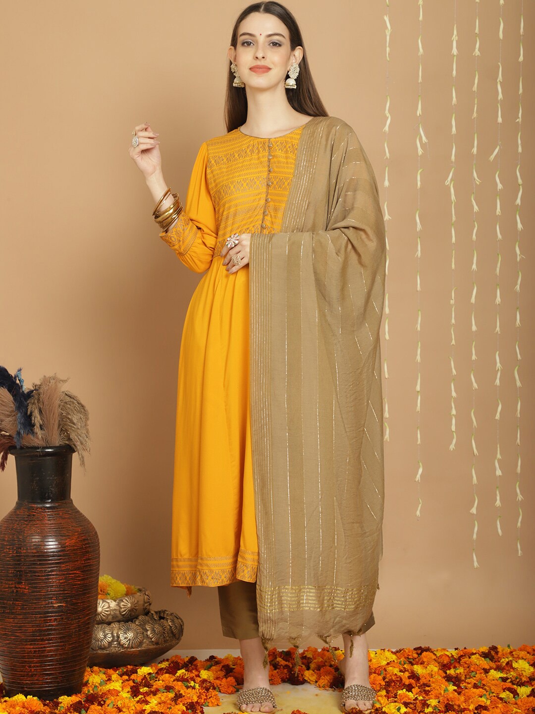 

Tulsattva Ethnic Motif Printed A-Line Kurta & Trousers With Dupatta, Mustard