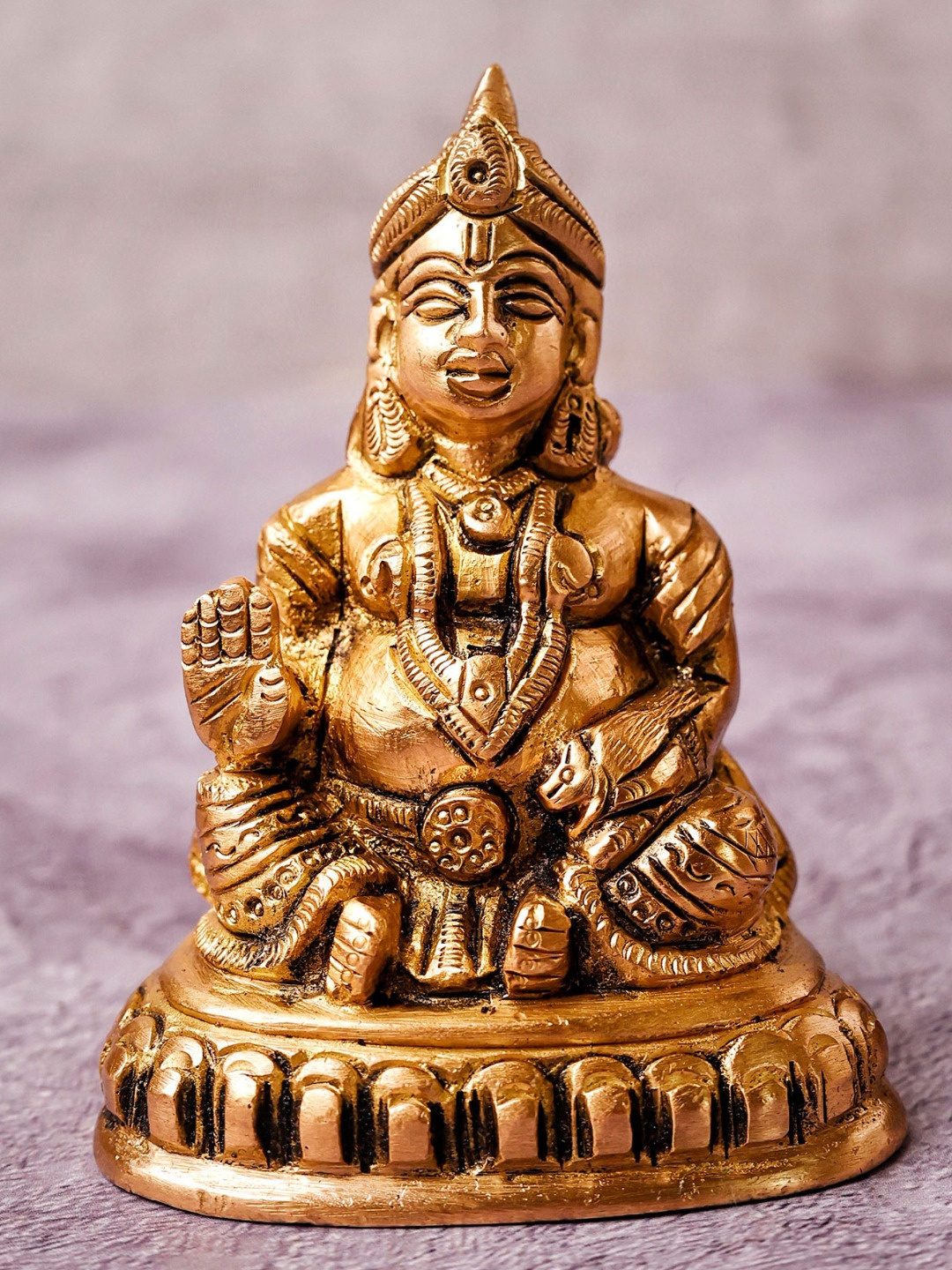 

The Advitya Gold Toned Brass Kubera Statue Sitting On Base Showpiece