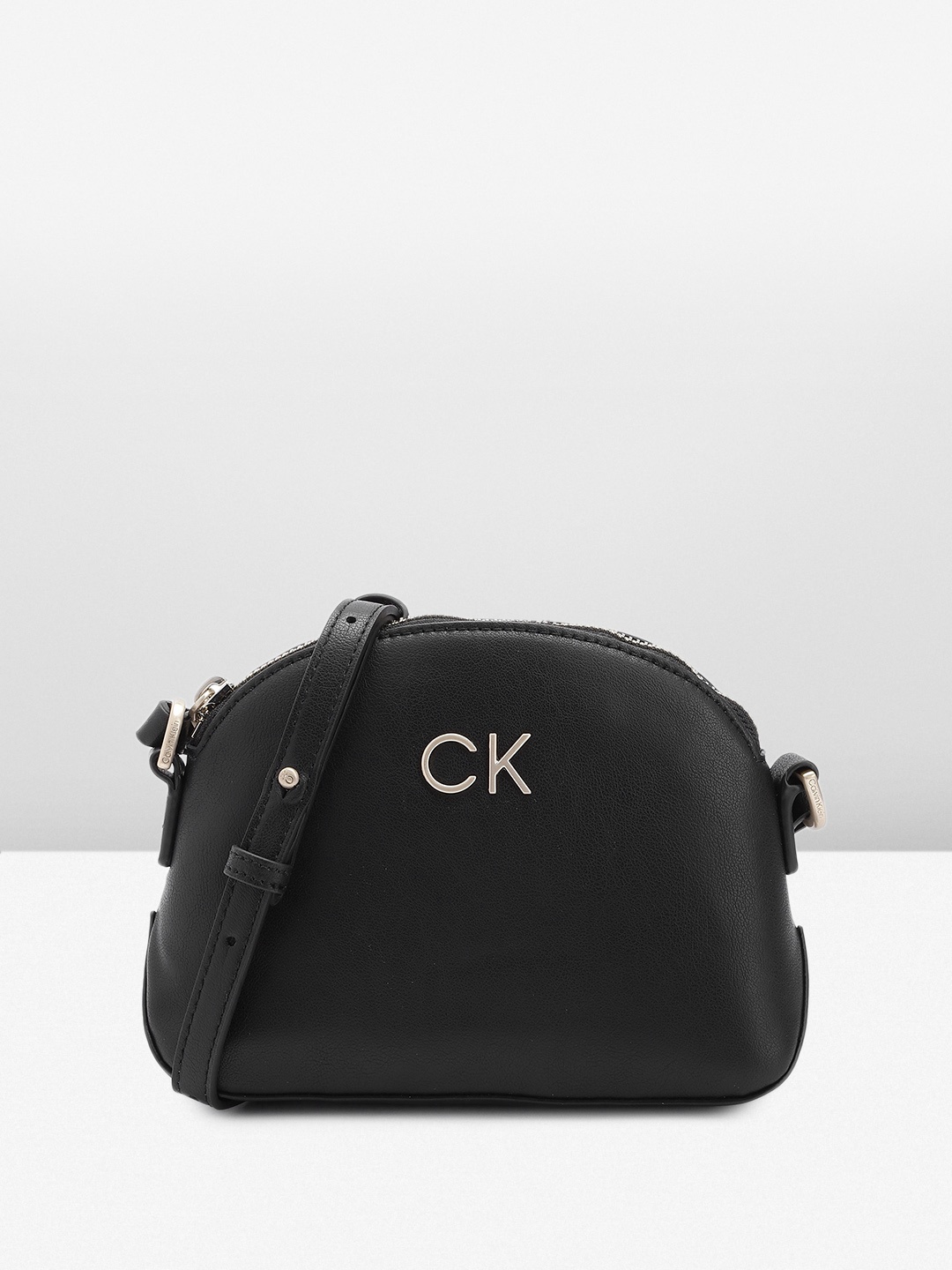

Calvin Klein Women Solid Sling Bag, Black