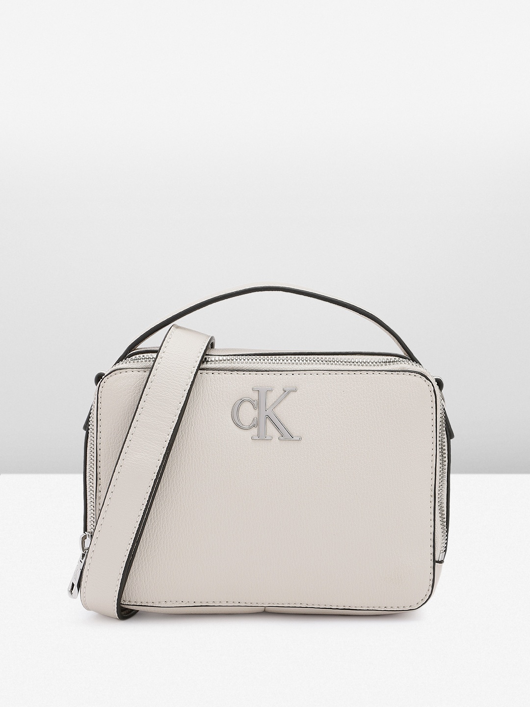 

Calvin Klein Women Solid Sling Bag, Off white