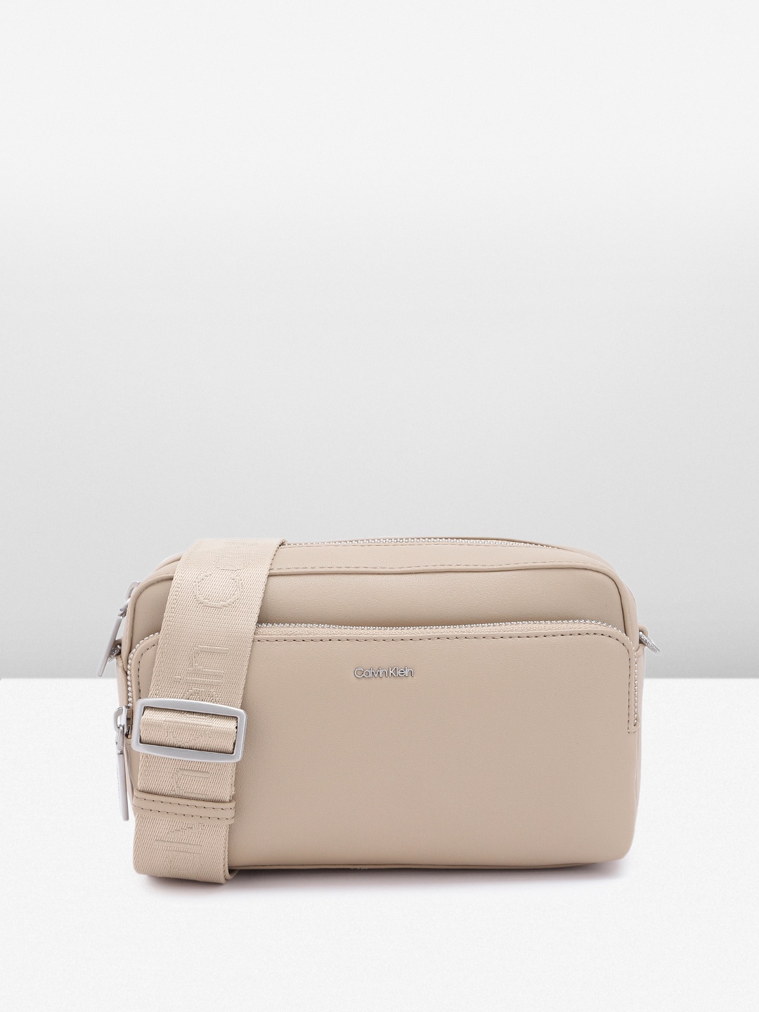 

Calvin Klein Women Solid Sling Bag, Beige