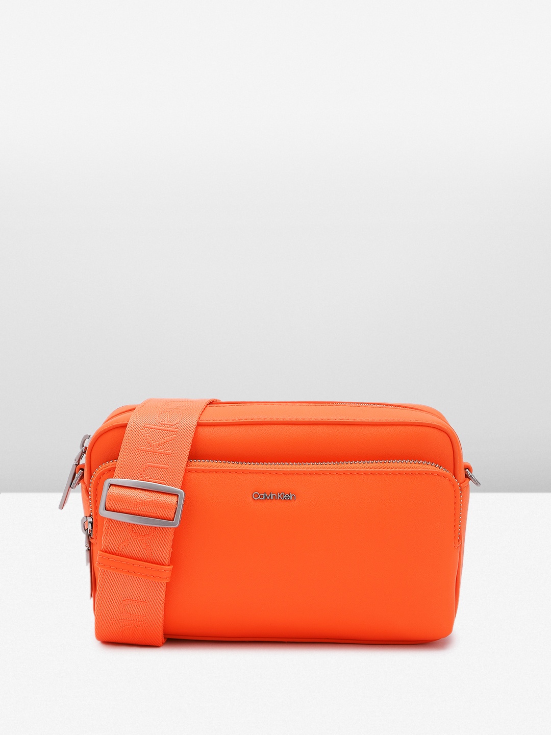 

Calvin Klein Women Solid Sling Bag, Orange