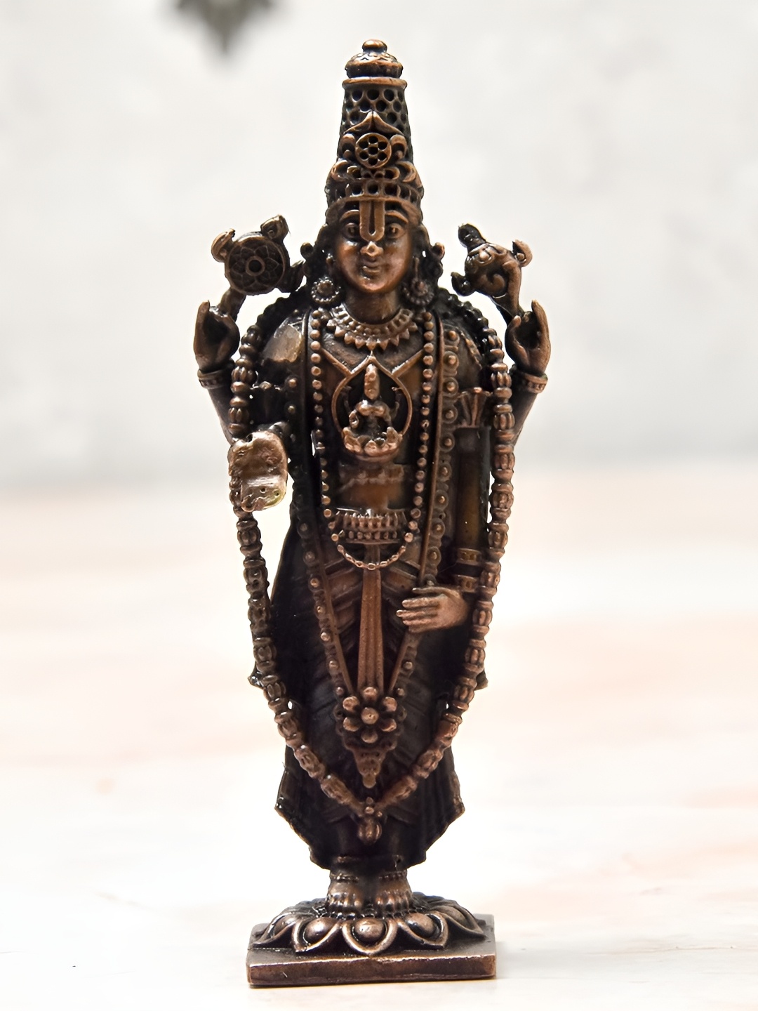 

Bhimonee Decor Copper Toned Balaji Idol Showpiece