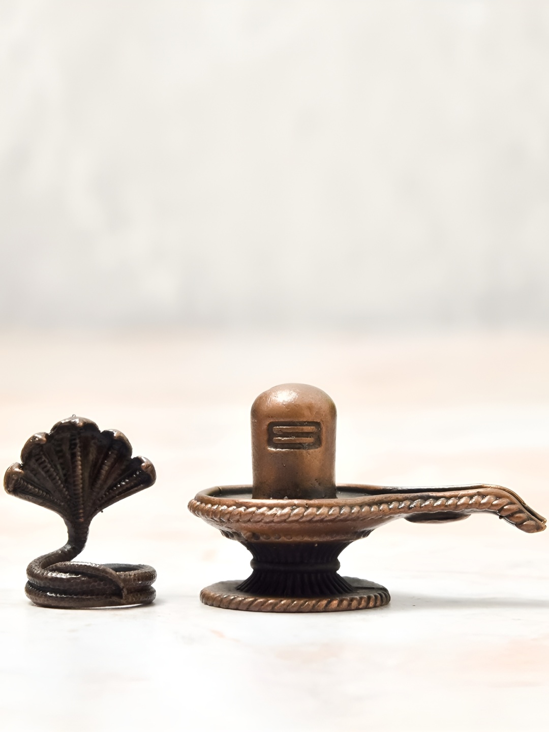 

Bhimonee Decor Brown Shivalinga Idol Showpiece