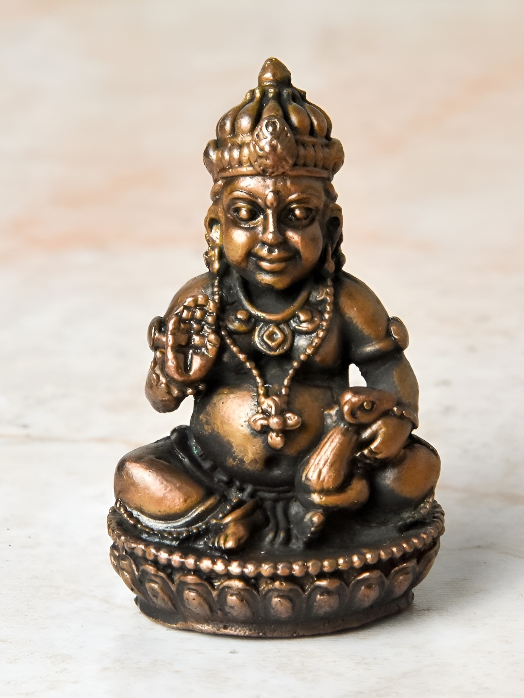 

Bhimonee Decor Copper Toned Kuber Idol Idol Showpiece