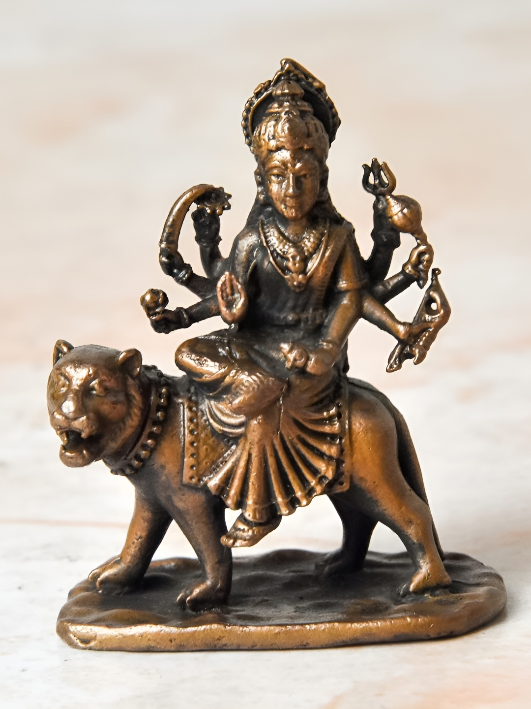 

Bhimonee Decor Copper-Toned &Brown Durga Idol Showpiece