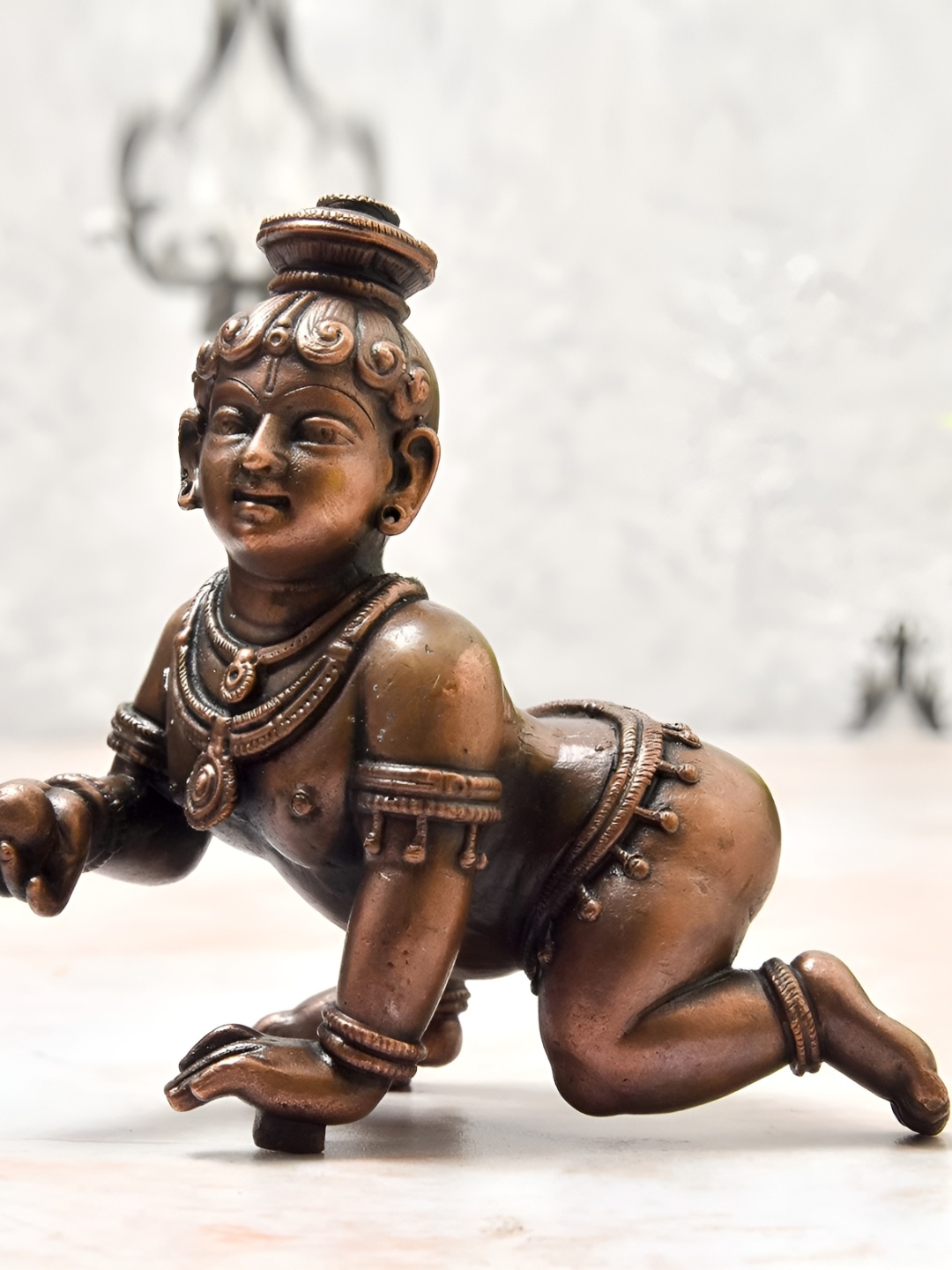 

Bhimonee Decor Copper-Toned &Brown Bal Krishna Idol Showpiece