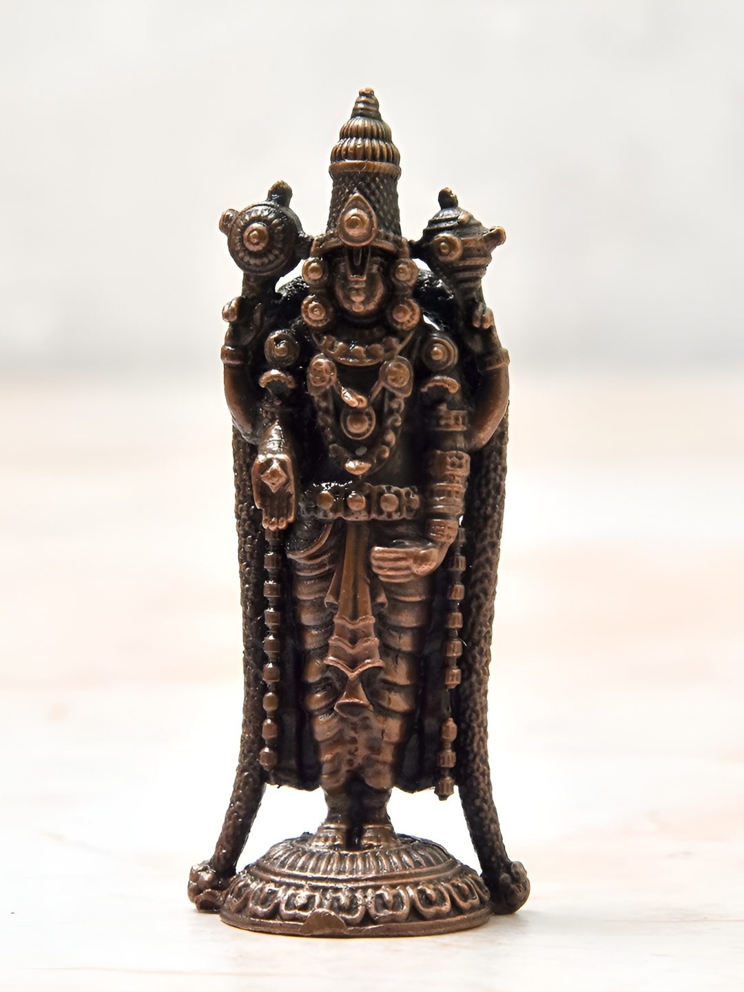 

Bhimonee Decor Copper-Toned& Brown Balaji Idol Showpiece