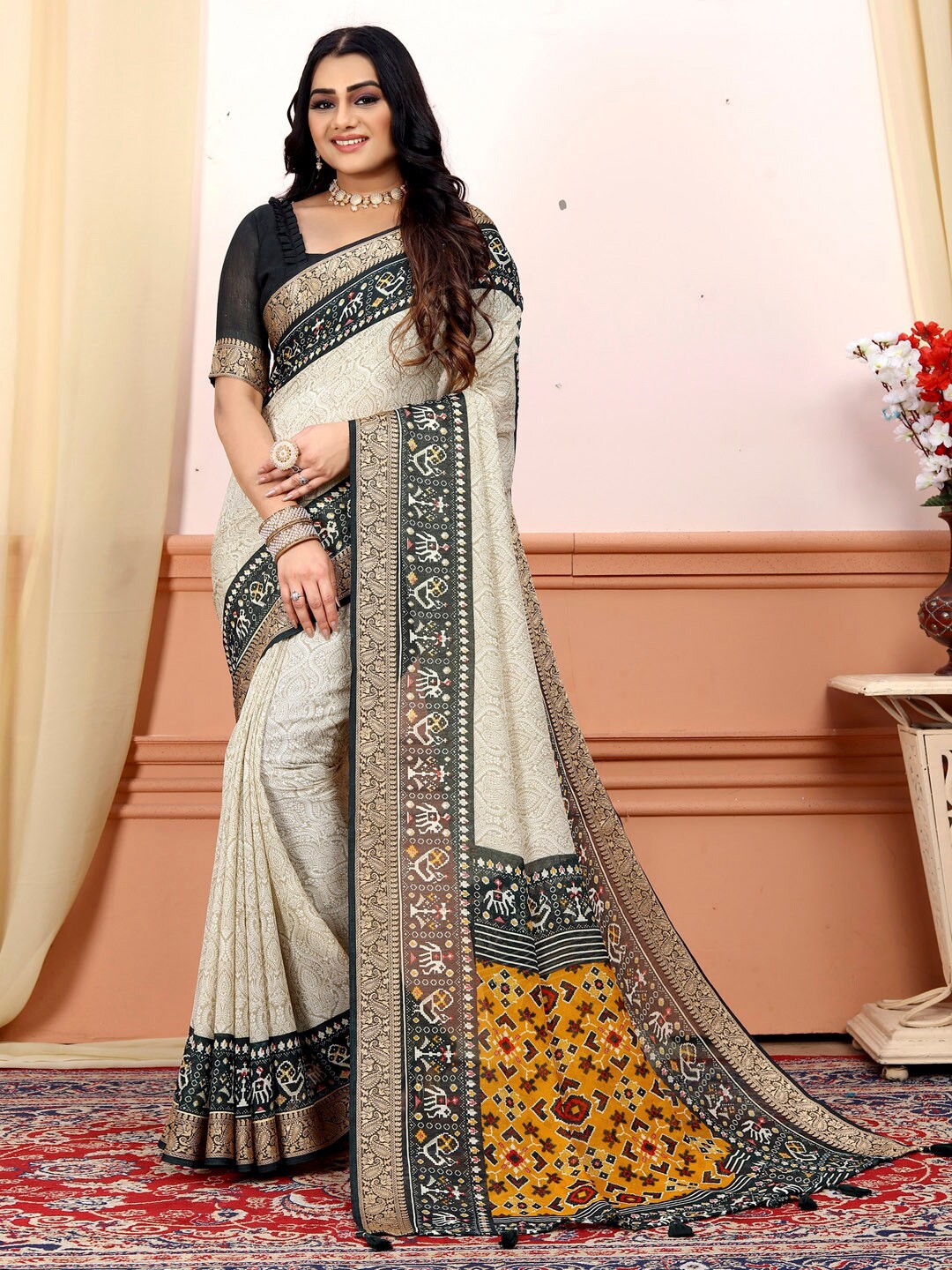 

Saree mall Cream-Coloured & Black Ethnic Motifs Printed Pure Georgette Zari Patola Sarees