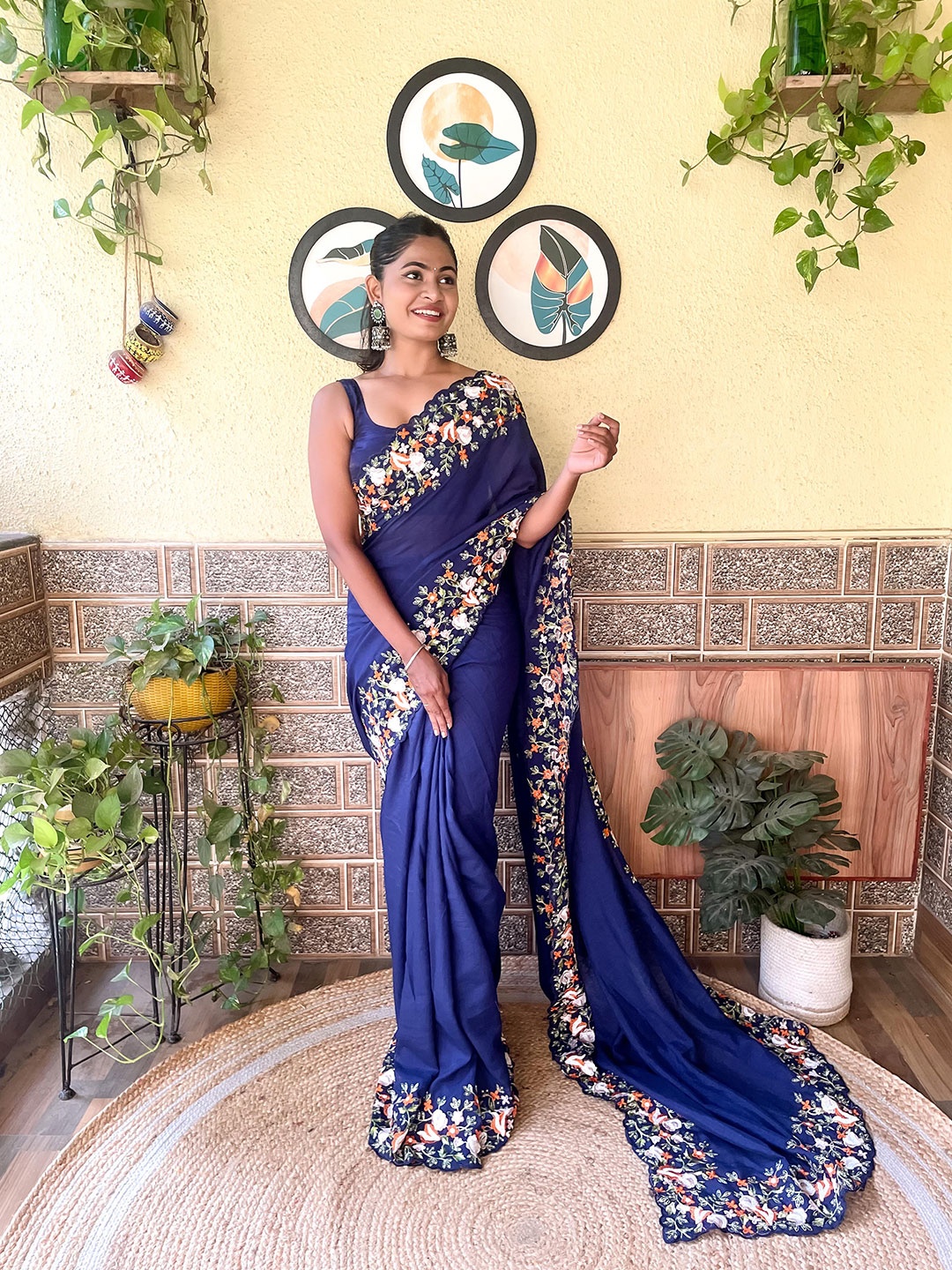 

Mitera Navy Blue Floral Embroidered Border Saree