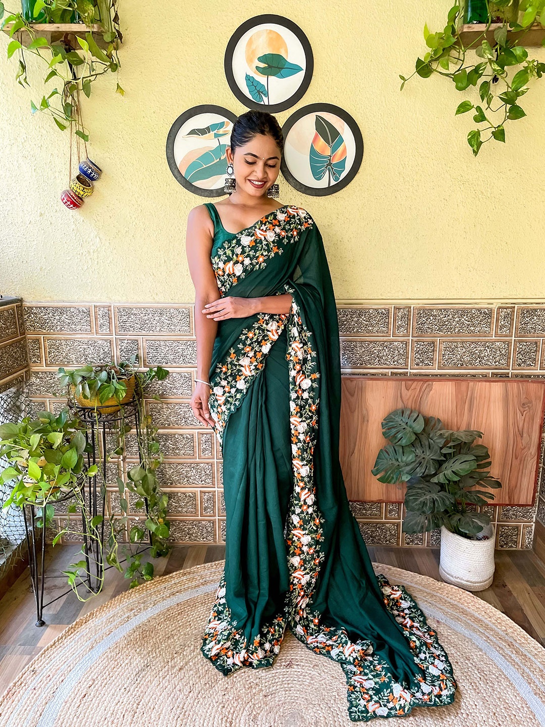 

Mitera Green Solid Embroidered Bordered Saree