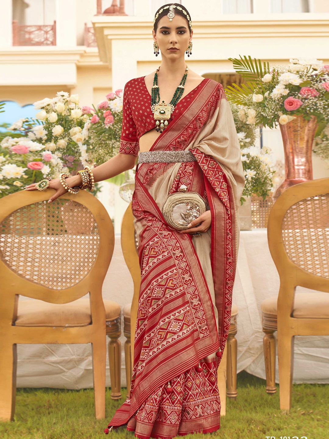 

Mitera Beige Ethnic Motifs Woven Design Zari Patola Saree