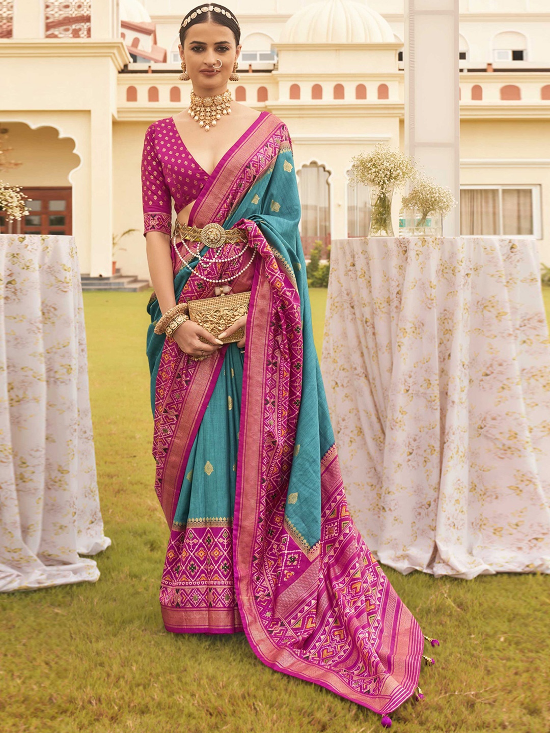 

Mitera Blue Ethnic Motifs Woven Design Zari Patola Saree