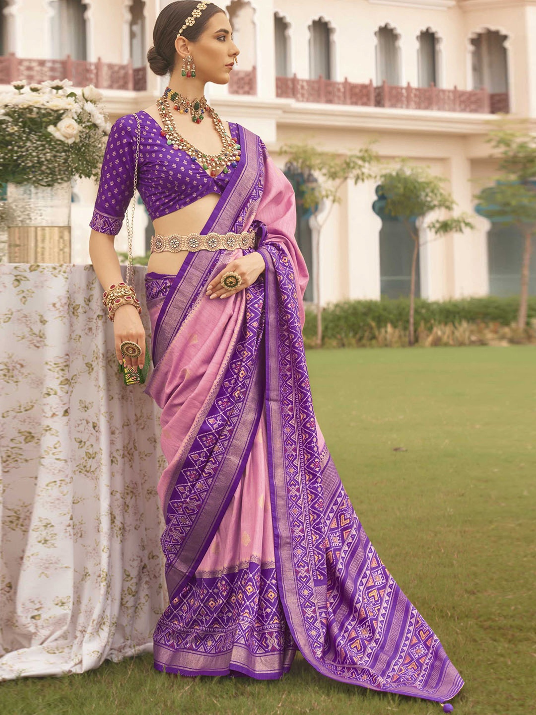 

Mitera Pink Ethnic Motifs Woven Designed Zari Patola Saree