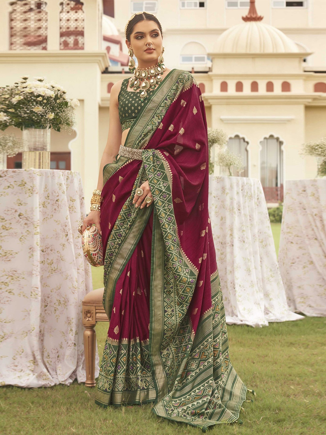 

Mitera Maroon Ethnic Motifs Woven Design Zari Patola Saree