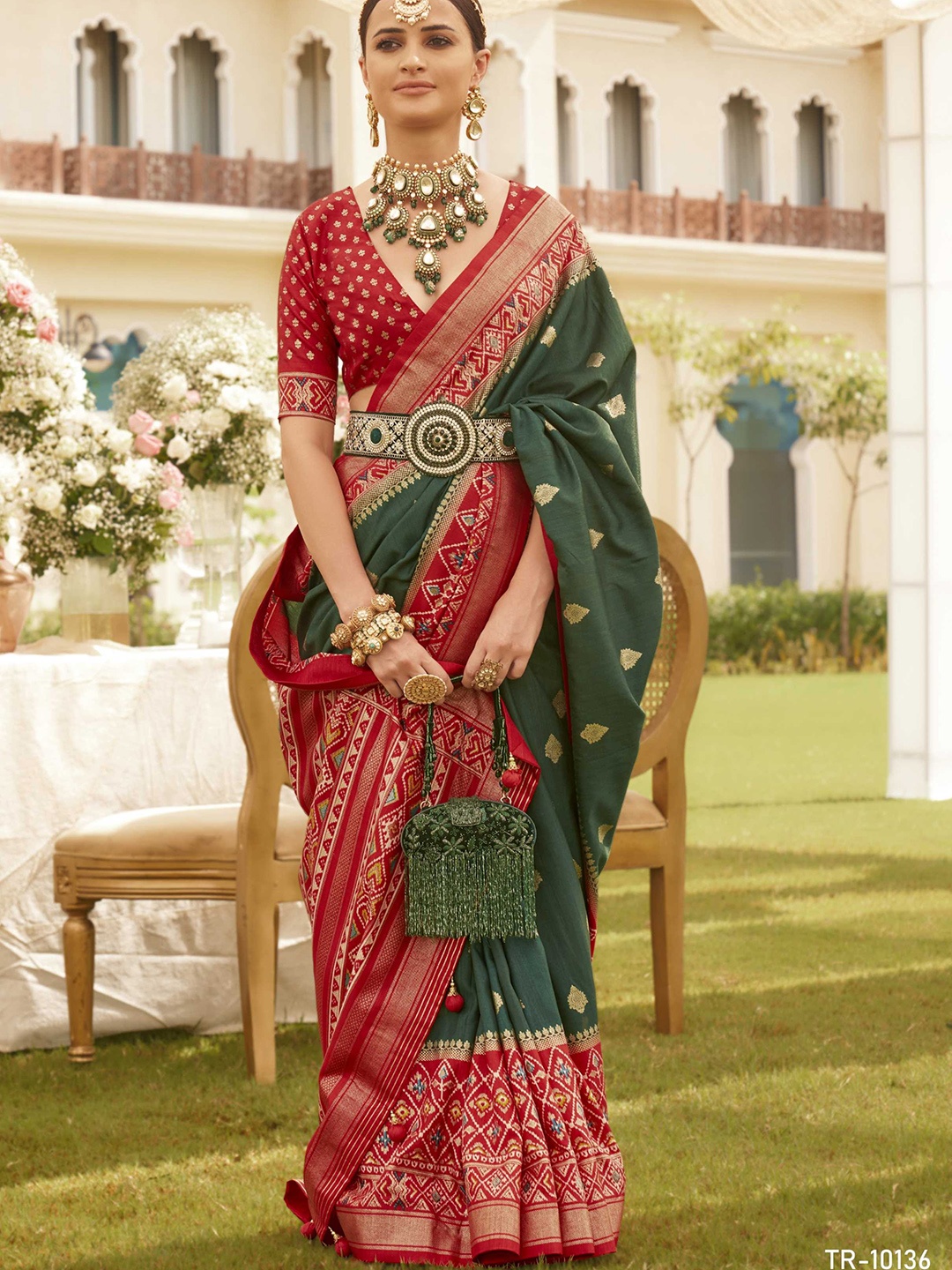 

Mitera Green Ethnic Motifs Printed Zari Silk Blend Patola Saree