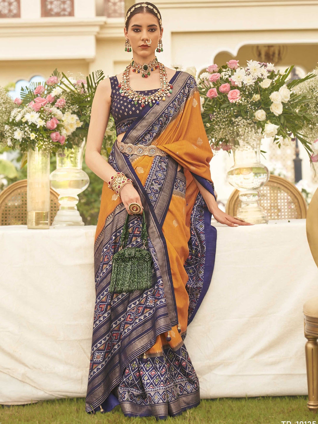 

Mitera Ethnic Motifs Woven Design Zari Detail Patola Saree, Orange