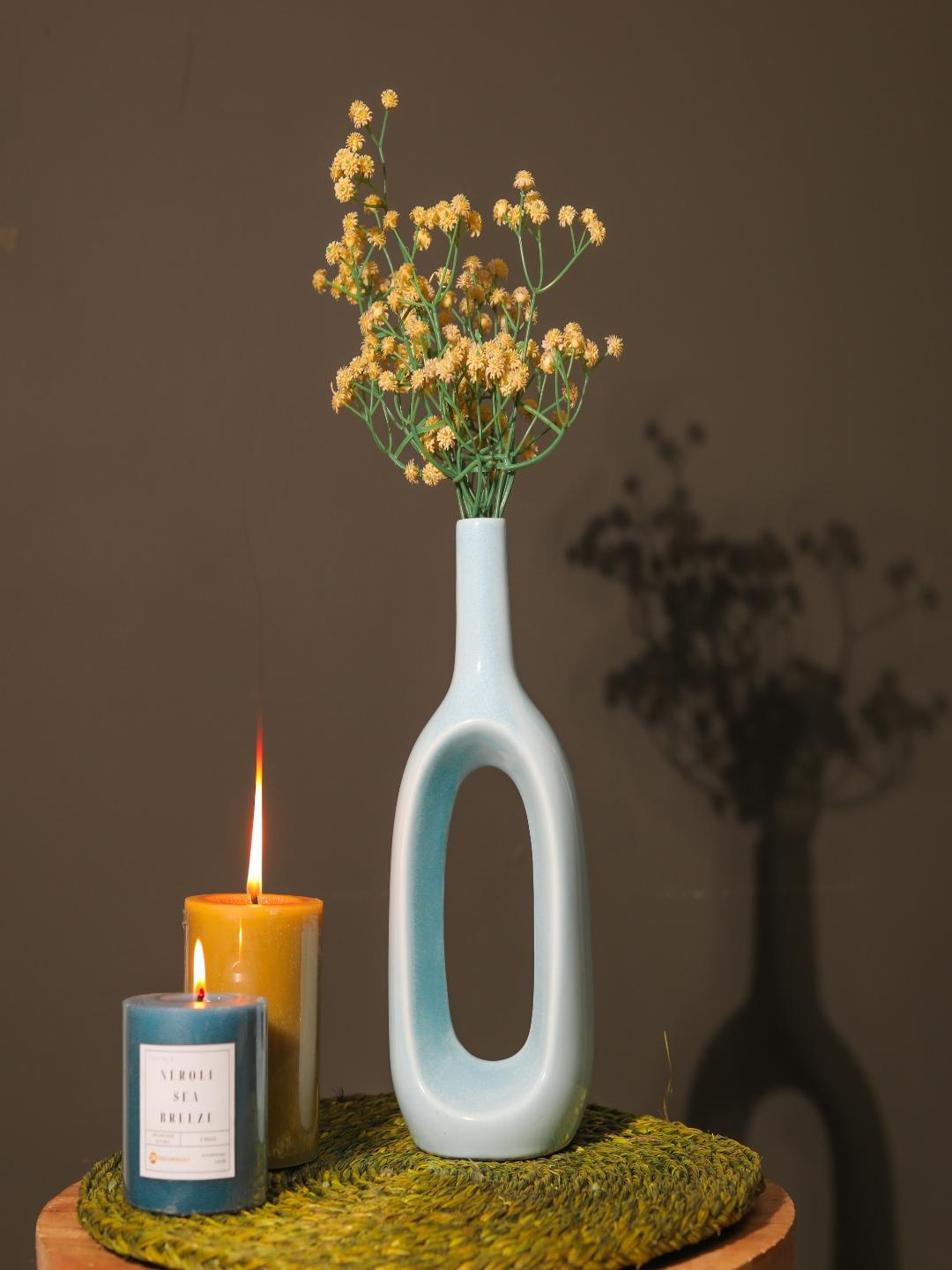 

The Decor Mart Blue Ceramic Hollow Flower Vases