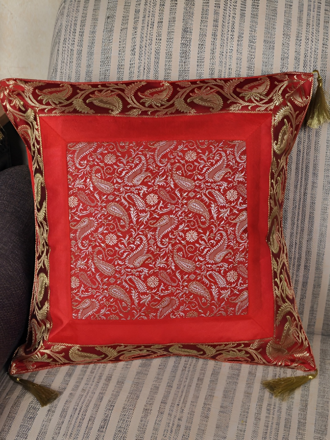 

Lal Haveli Red & Gold Toned Ethnic Motifs Square Cushion Cover