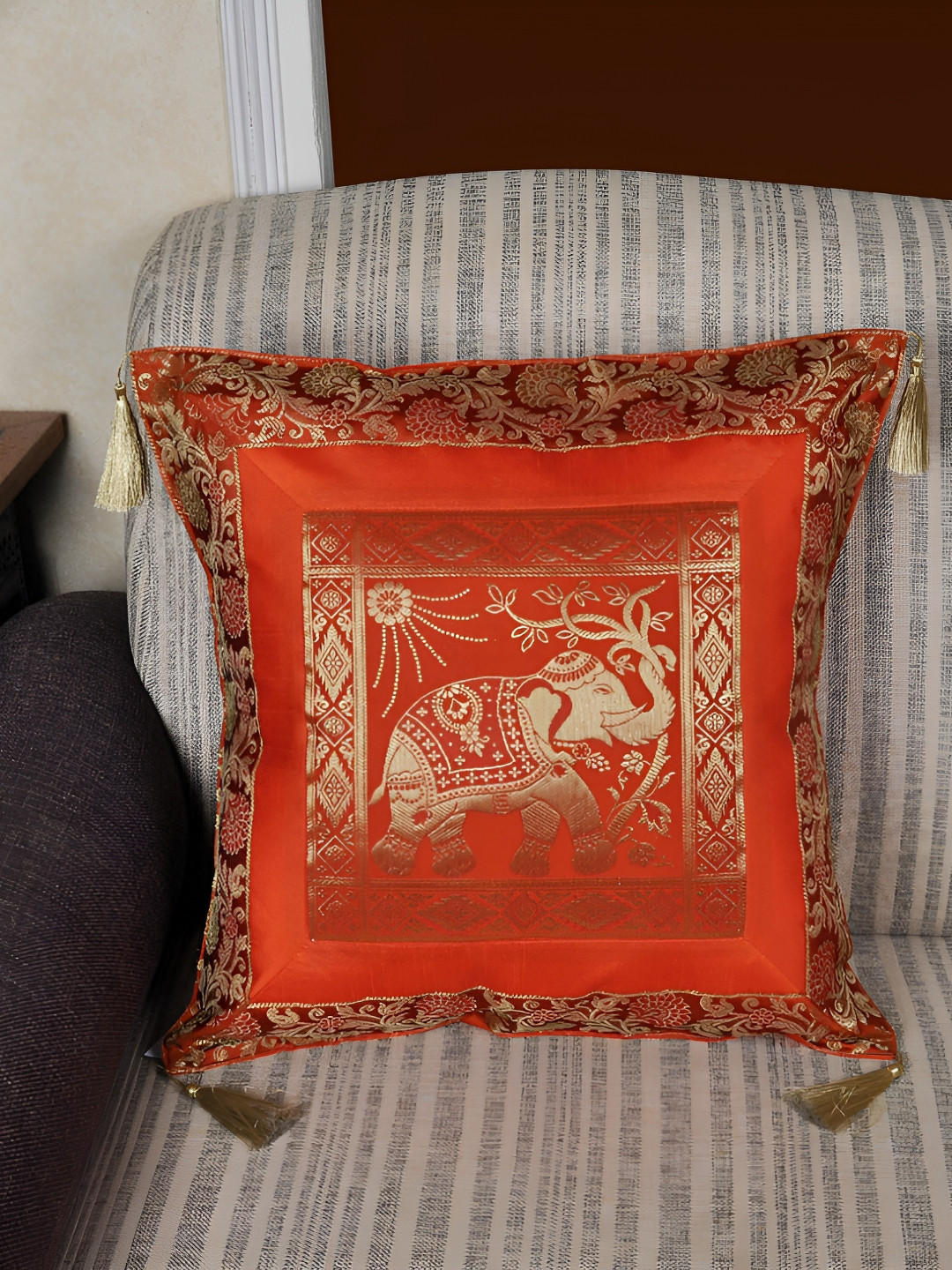 

Lal Haveli Orange & Gold Toned Ethnic Motifs Square Cushion Cover