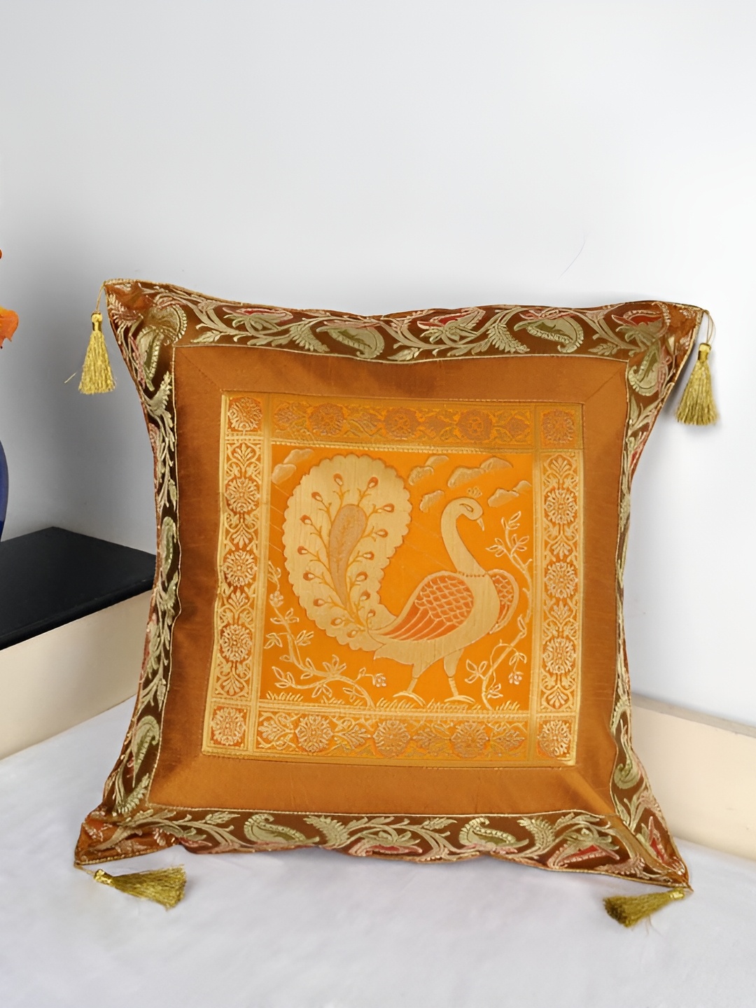 

Lal Haveli Gold Toned Ethnic Motifs Square Cushion Cover