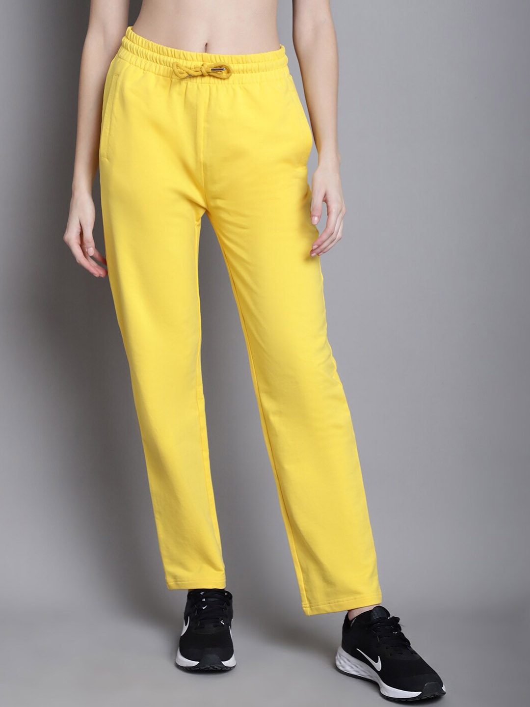 

DressBerry Women Typography Printed Mid-Rise Cotton Track Pants, Yellow