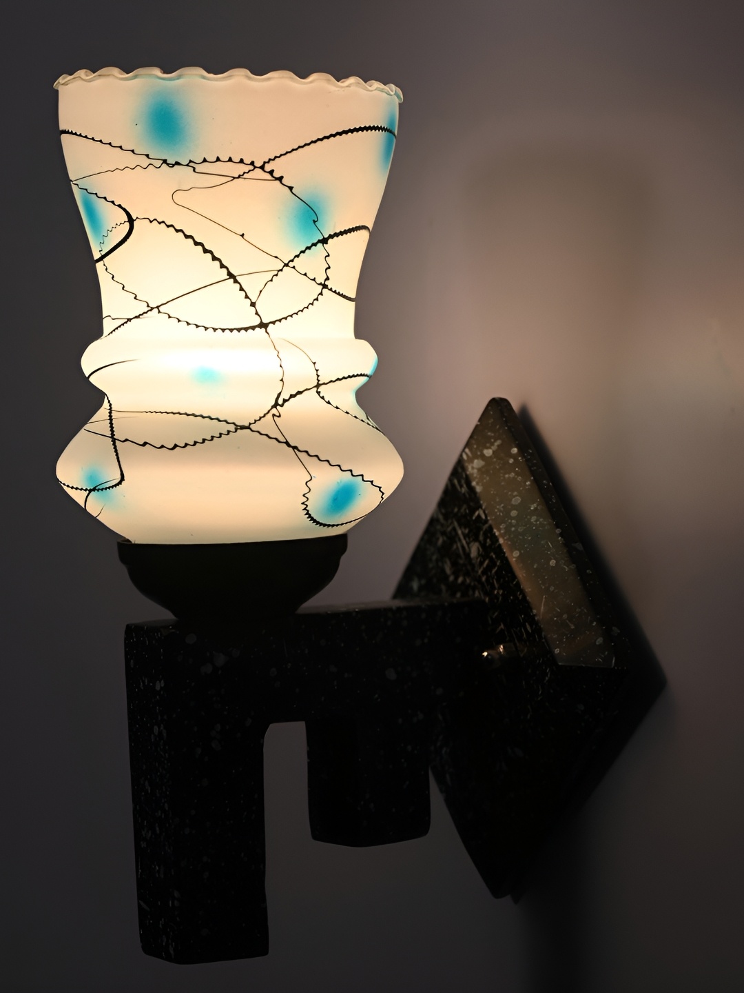 

Afast Blue & Black Printed Abstract Shaped Glass Wall Lamp