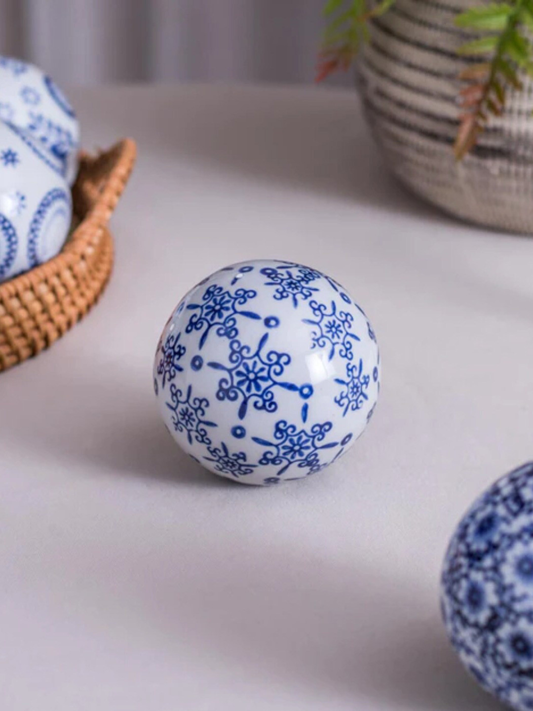 

THEDECORKART White & Blue Ethnic Motifs Printed Curio Showpiece