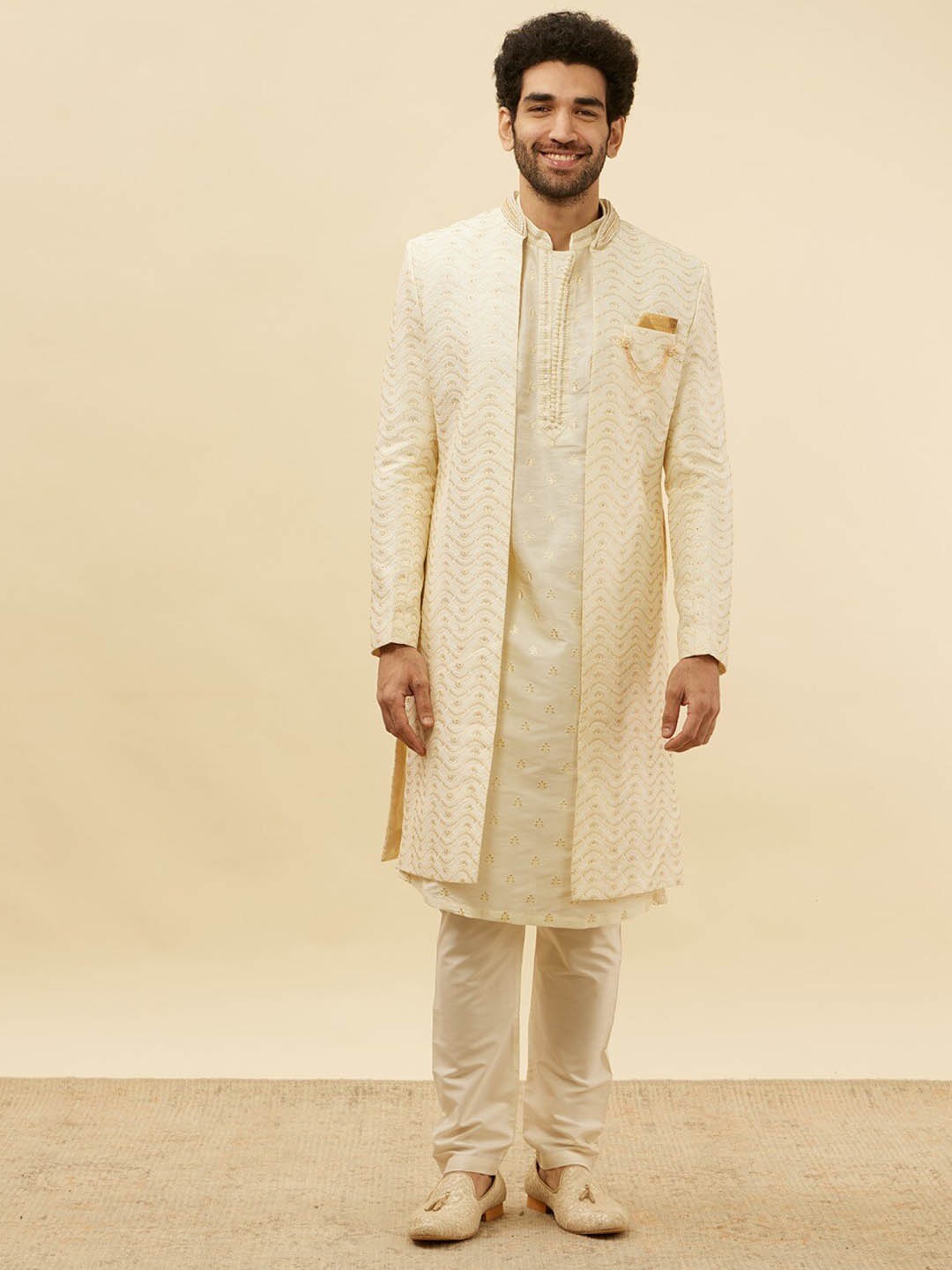 

Manyavar Floral Embroidered Mandarin Collar Beads & Stones Sherwani With Pyjama & Coat, Cream