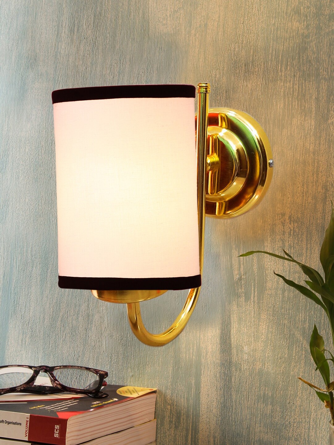 

Devansh White & Gold-Toned Textured Contemporary Metal Cylinder Wall Lamp