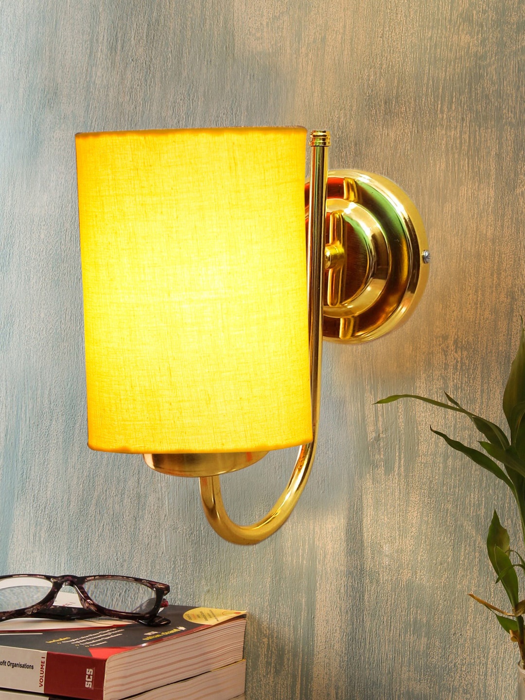 

Devansh Yellow & Gold-Toned Textured Contemporary Metal Cylinder Wall Lamp