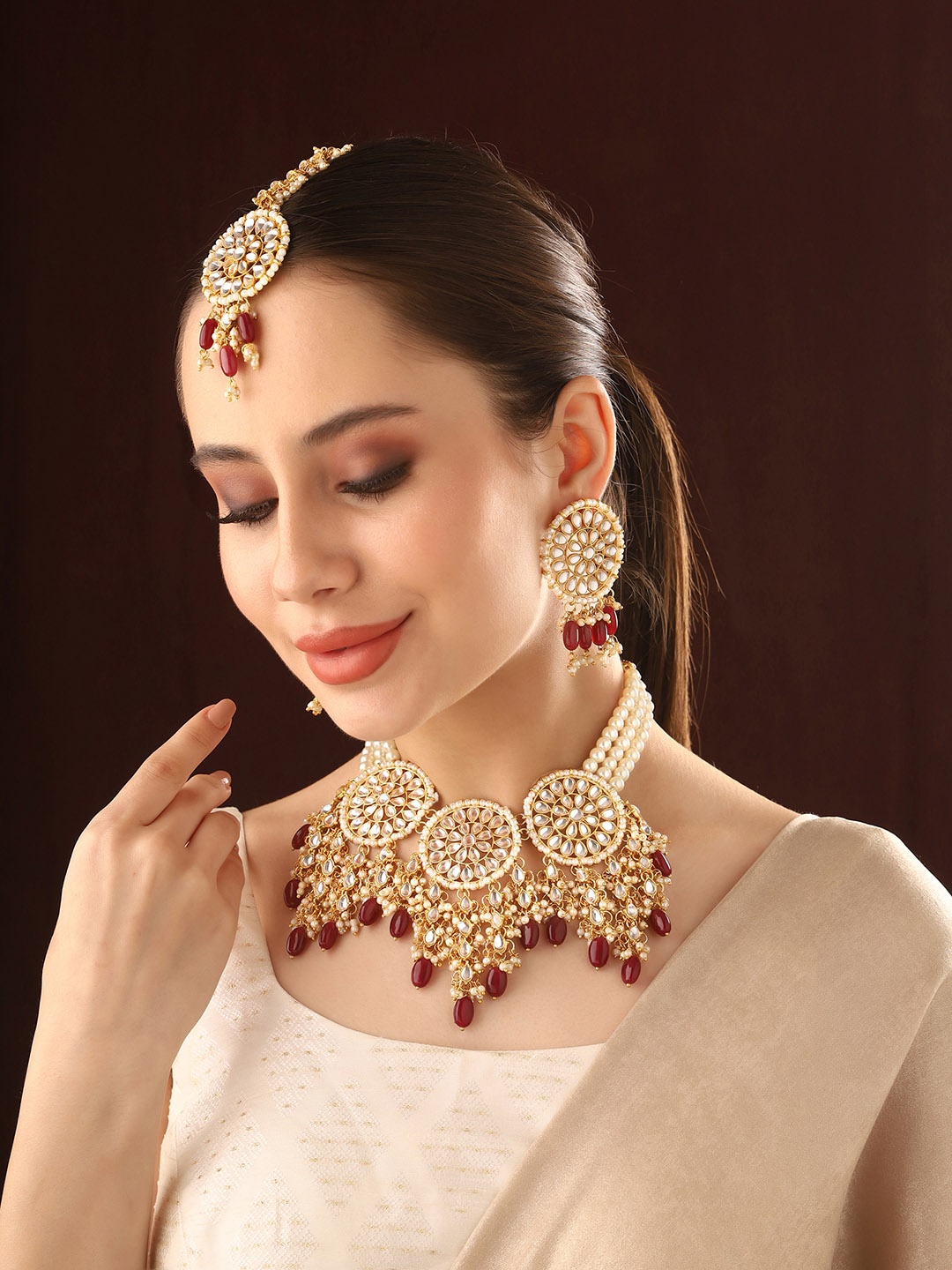 

Priyaasi Gold-Plated Stones-Studded & Beaded Jewellery Set