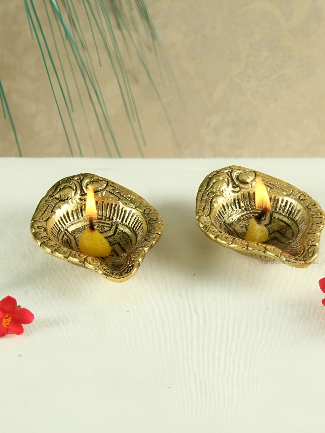 

HANDICRAFTS PARADISE Gold Toned 2 Pcs Peacock Engraved Antique Metal Pooja Diyas