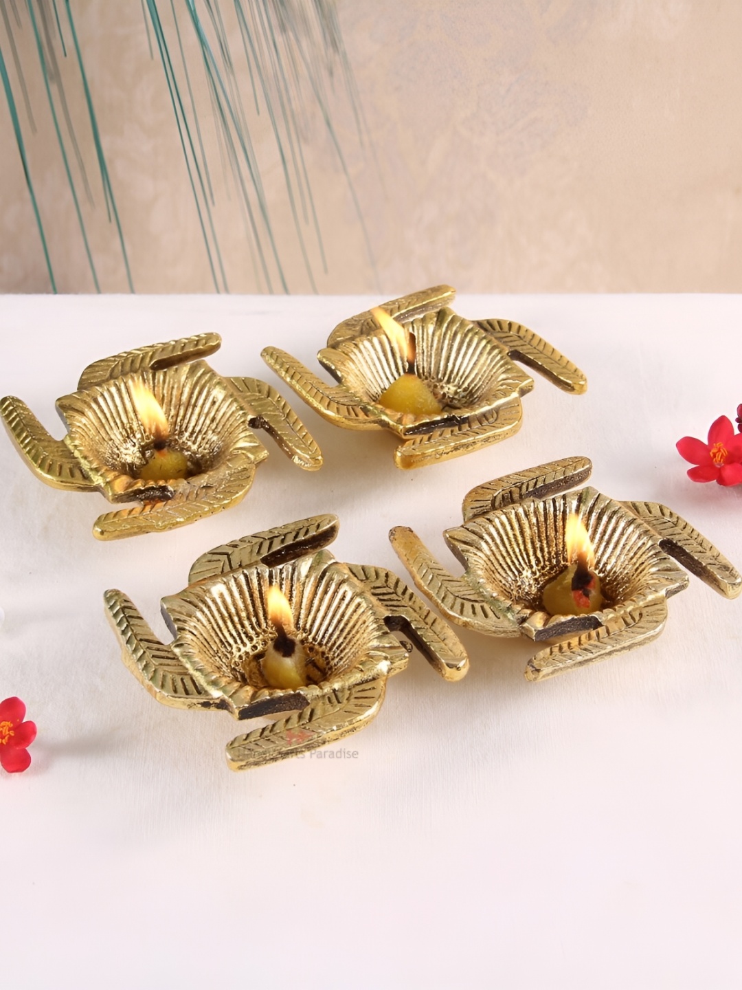 

HANDICRAFTS PARADISE Gold Toned 4 Pcs Swastik Shaped Diyas