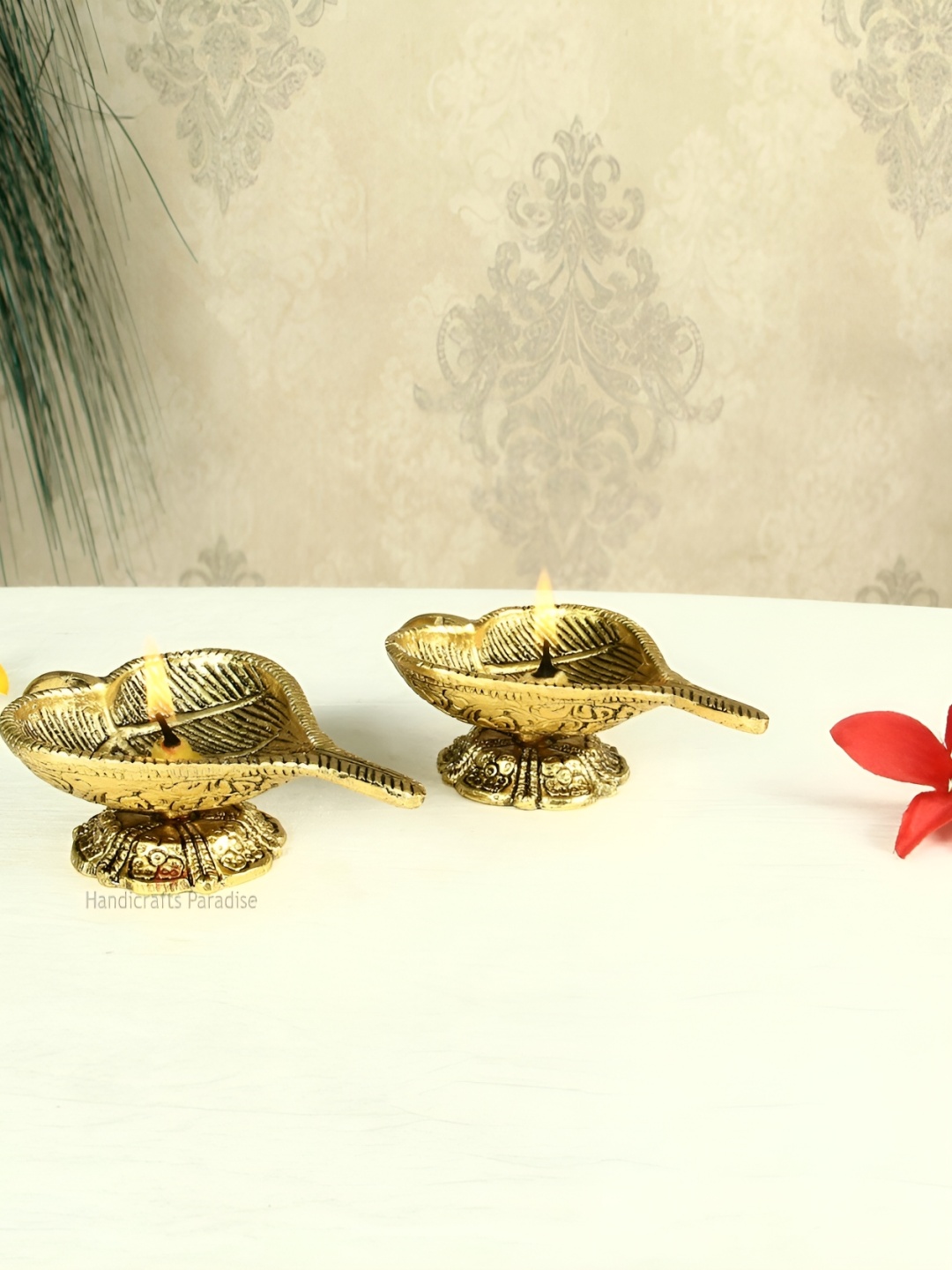 

HANDICRAFTS PARADISE Gold Toned 2 Pcs Leaf Shaped Antique Metal Pooja Diyas