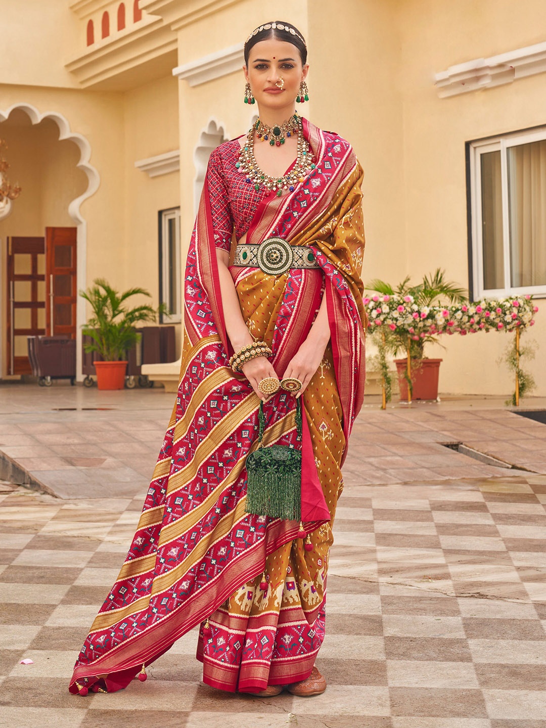 

Mitera Mustard Yellow Ethnic Motifs printed Patola Saree