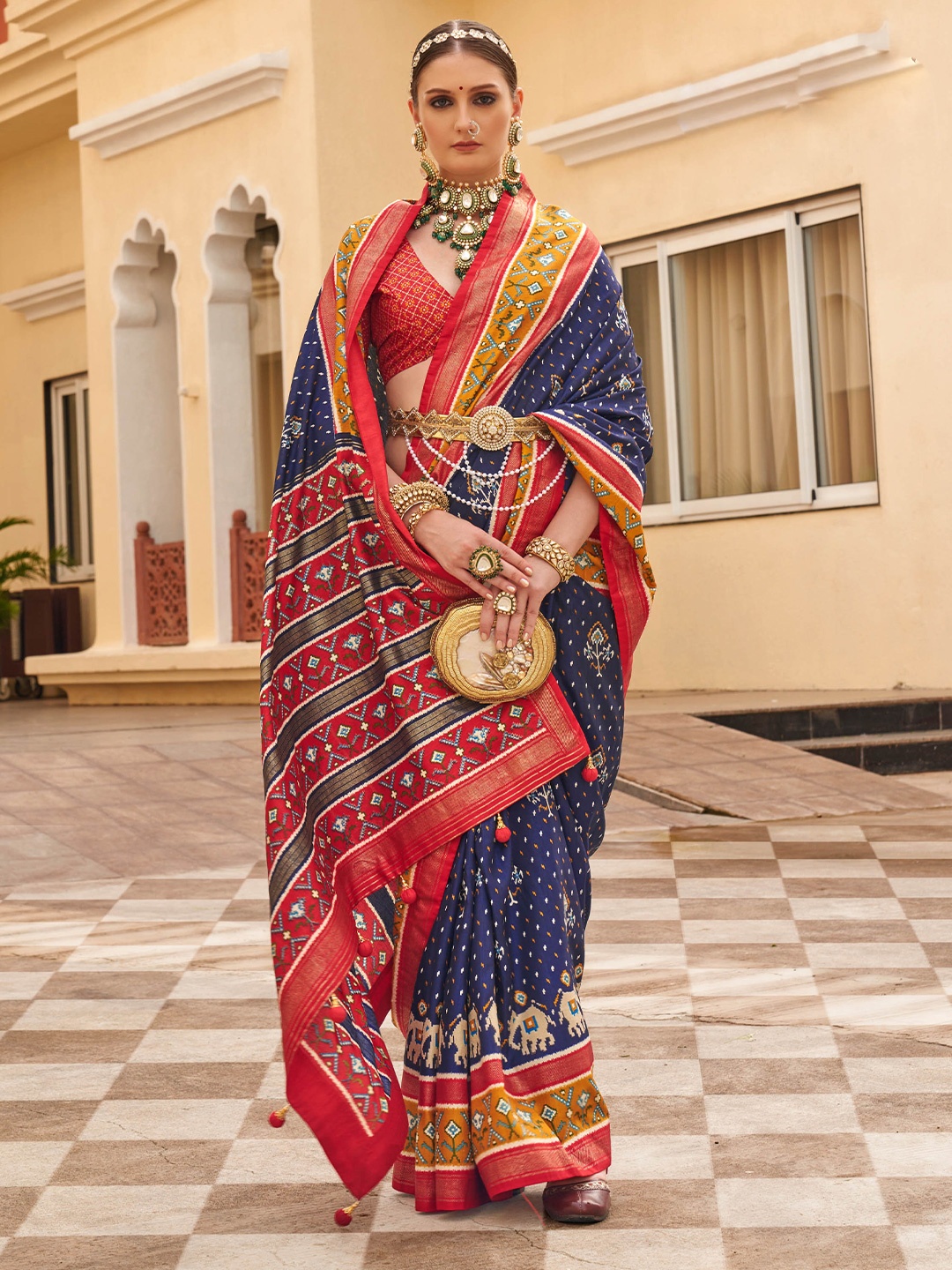 

Mitera Navy Blue Ethnic Motifs Printed Patola Saree