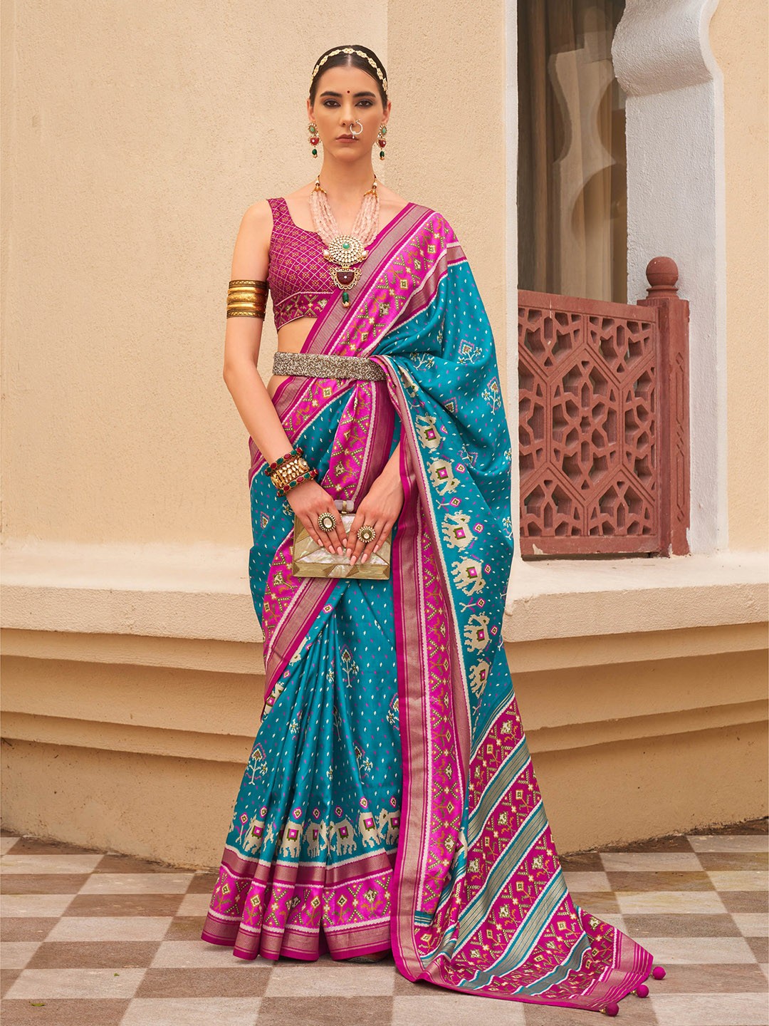 

Mitera Blue Ethnic motifs Printed Patola Saree