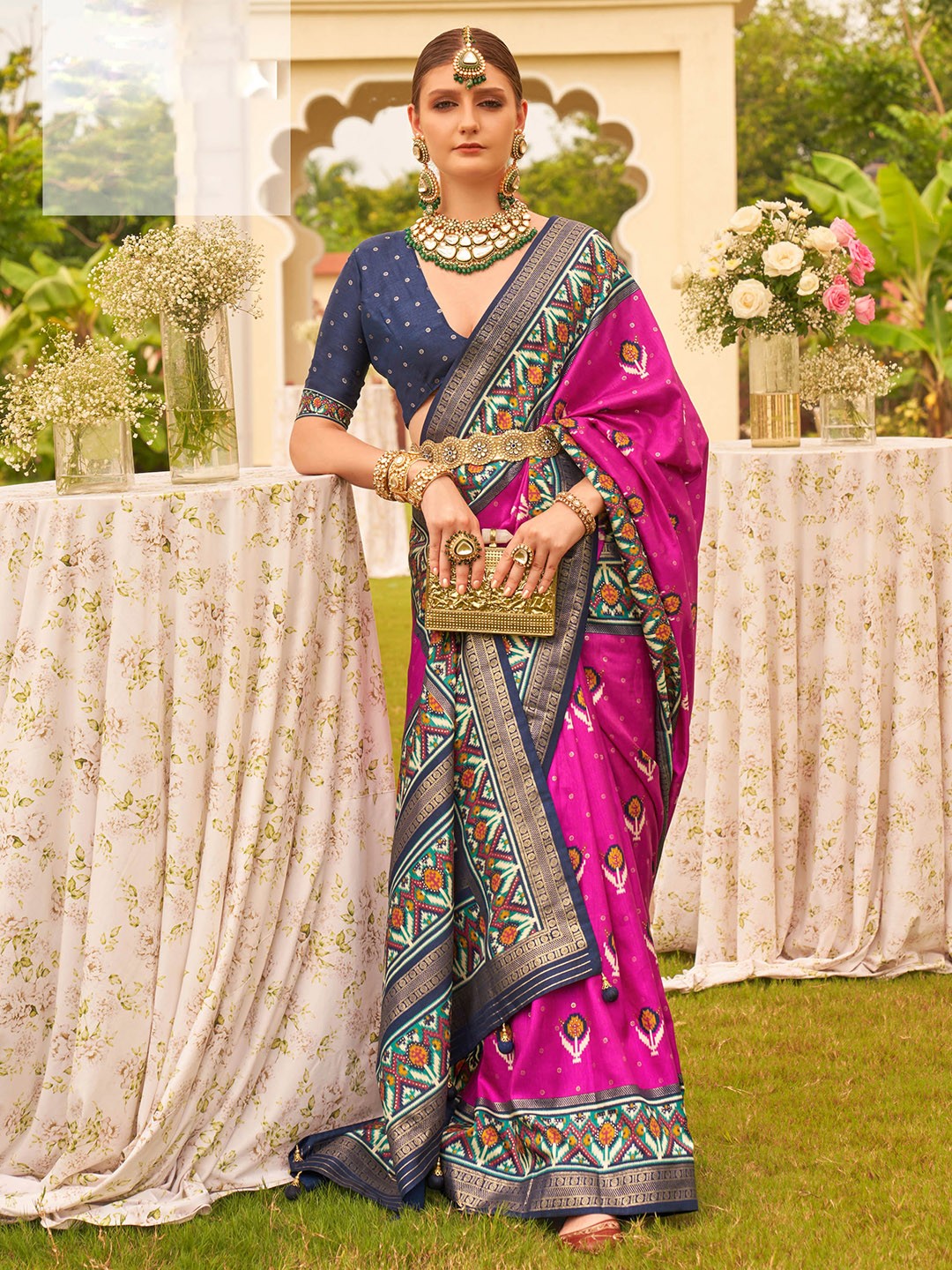 

Mitera Pink & Blue Ethnic Motifs Printed Patola Saree