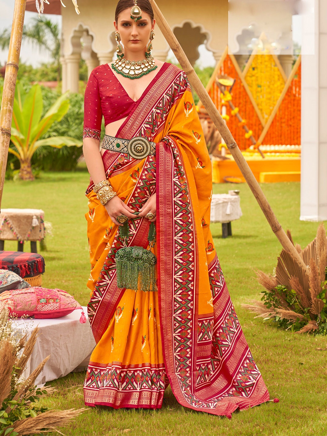 

Mitera Mustard Yellow Ethnic Motifs Printed Patola Saree