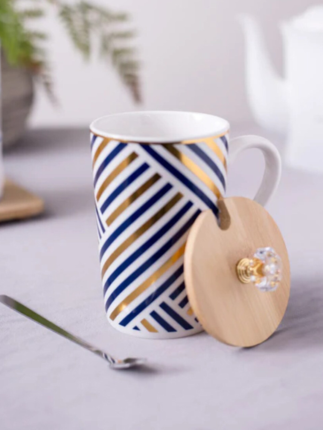 

THEDECORKART White & Blue 3 Pieces Striped Ceramic Mug with Lid & Spoon 300 ML