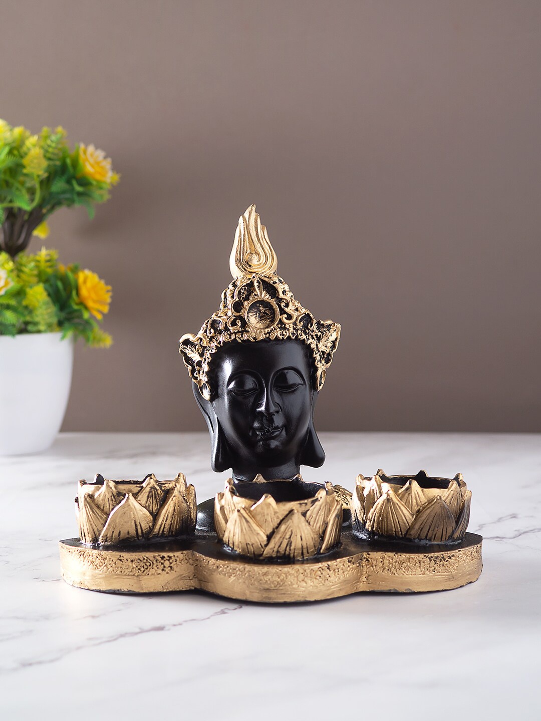 

Golden Peacock Gold-Toned & Black Buddha Diya Holder Idol Showpiece